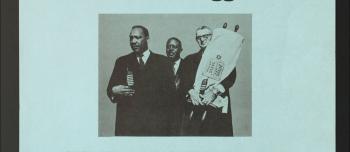 Blue cover of a publication with the words A Common Road to Freedom: A Passover Hagaddah, with a photograph of three faith leaders, one holding a Torah.